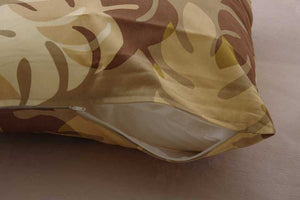 カジュアルなリーフ柄で人気の天然コットン100%クッションカバー モンステラ 同色2枚組 ブラウン - TOCO LIFE